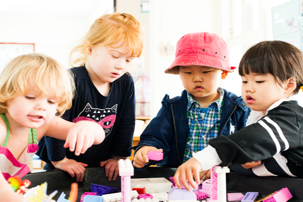 Children play with building blocks.