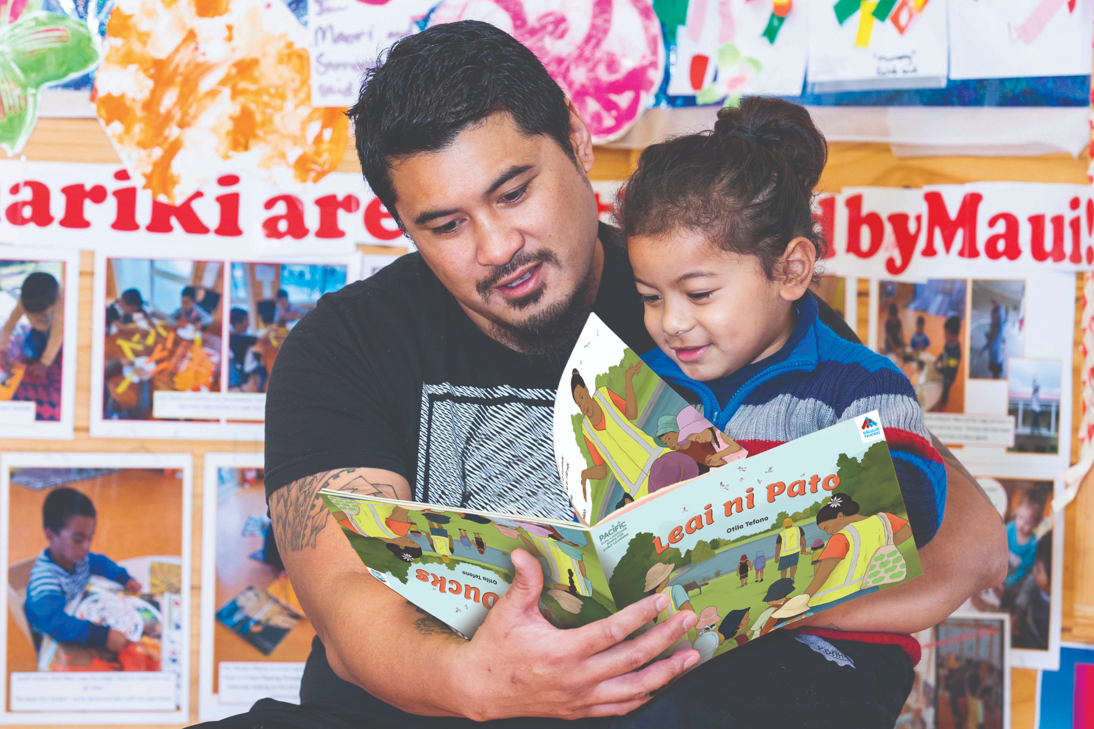 Father and son reading together