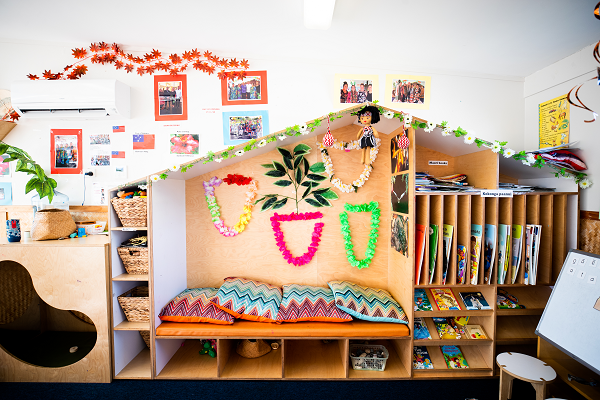 Space at a Pacific service for reading with colourful cushions and slots for books