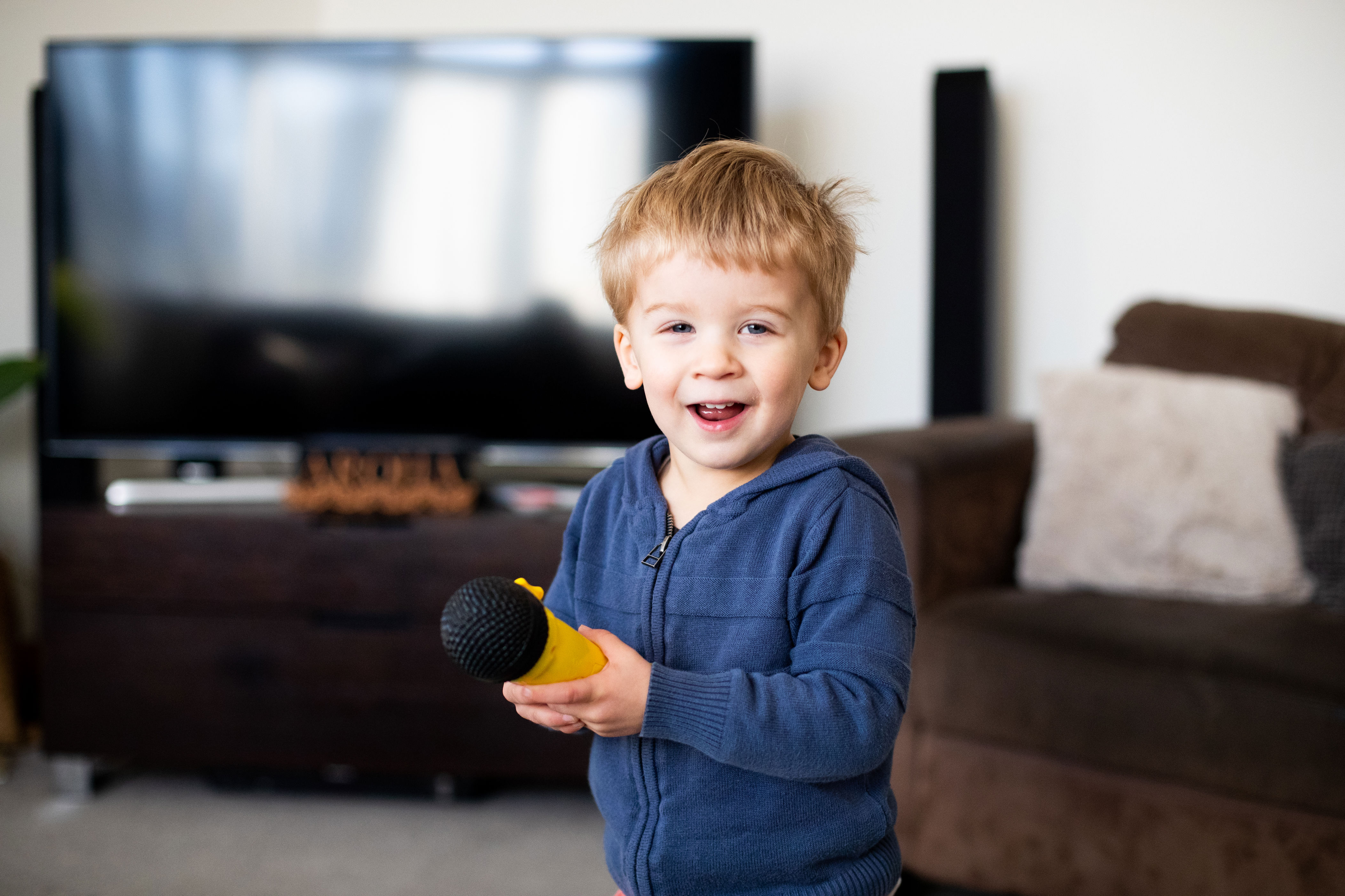 child in a home based service using a microphone