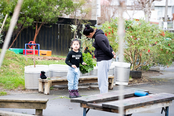 kaiako and child in conversation outside