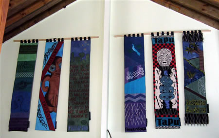 Six completed panels hanging in the wharenui.