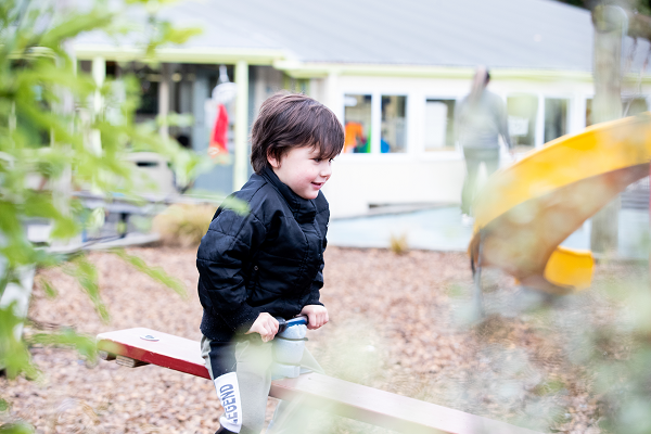 A child playing on a seesaw