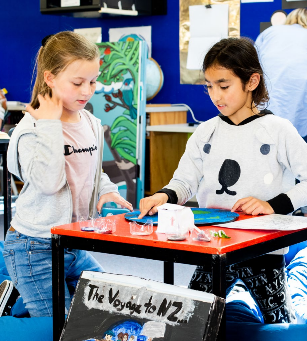 Two students looking at a map.jpeg