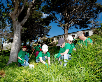 Teacher and students gardening.jpeg