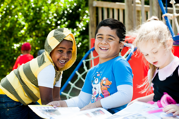 three children talking and laughing together