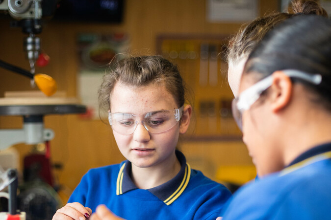 Young ākonga concentrating in class