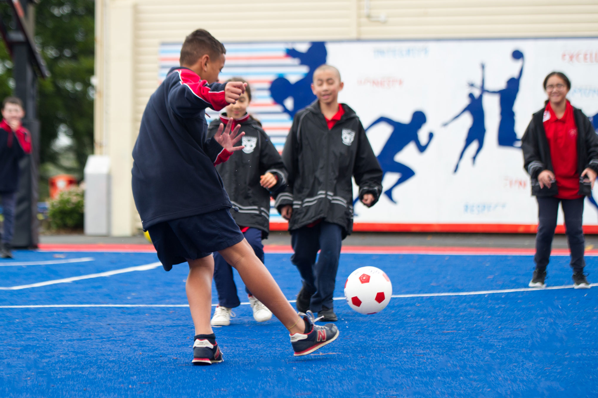 Students playing football.