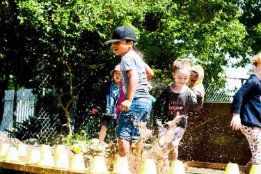 Children from Balclutha Playcentre playing outside.