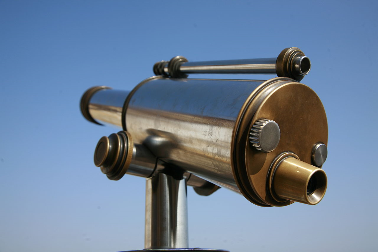 Brass telescope with a small and larger barrel on a steel stand