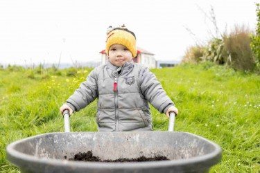 Child with a wheelbarrow