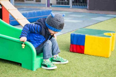 Child playing on a slide