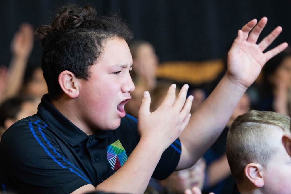 Young boy doing kapa haka.