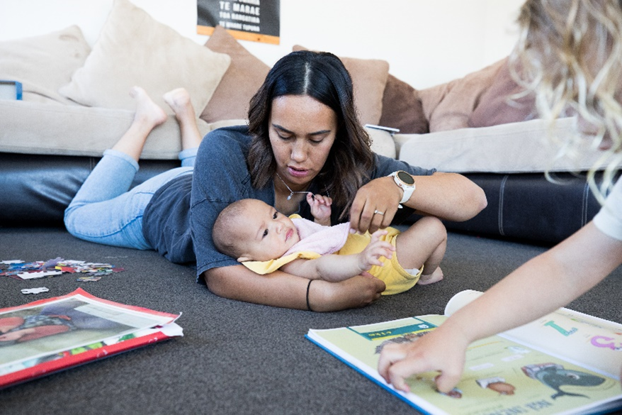 adult holding infant