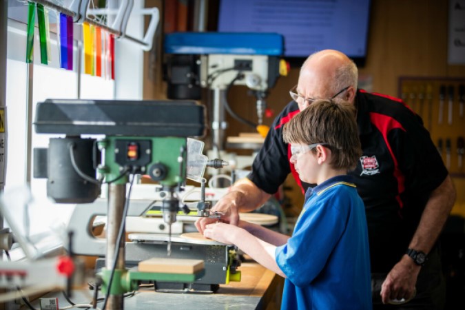 Teacher and student in woodwork class.