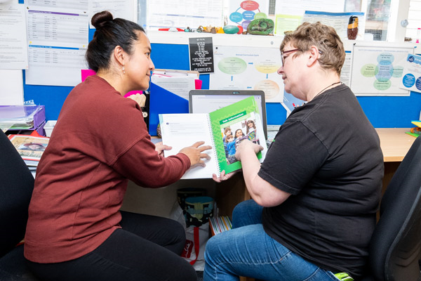 Two teachers talking together.