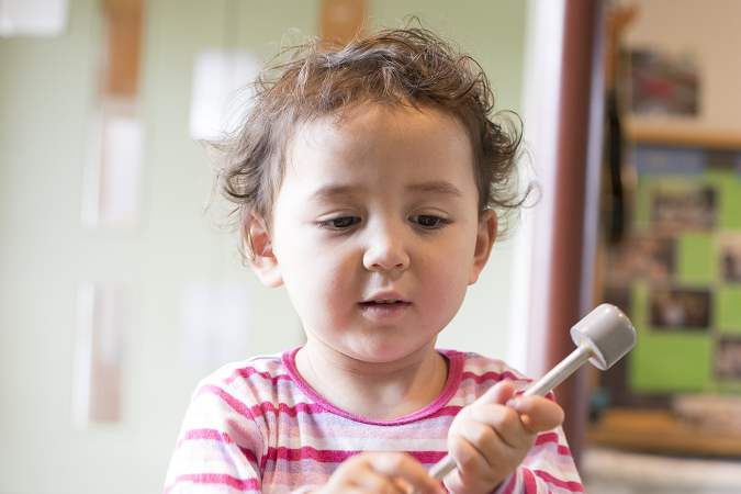 Child playing the drums 