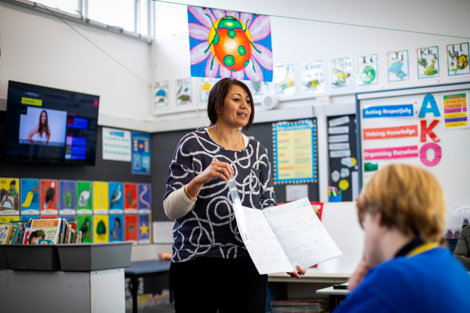 Kaiako teaching students in class.