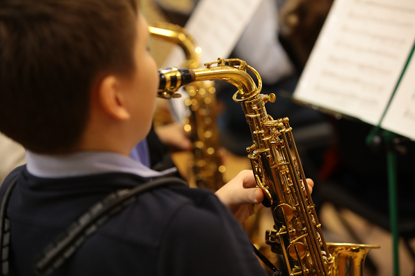 Child playing a musical instrument