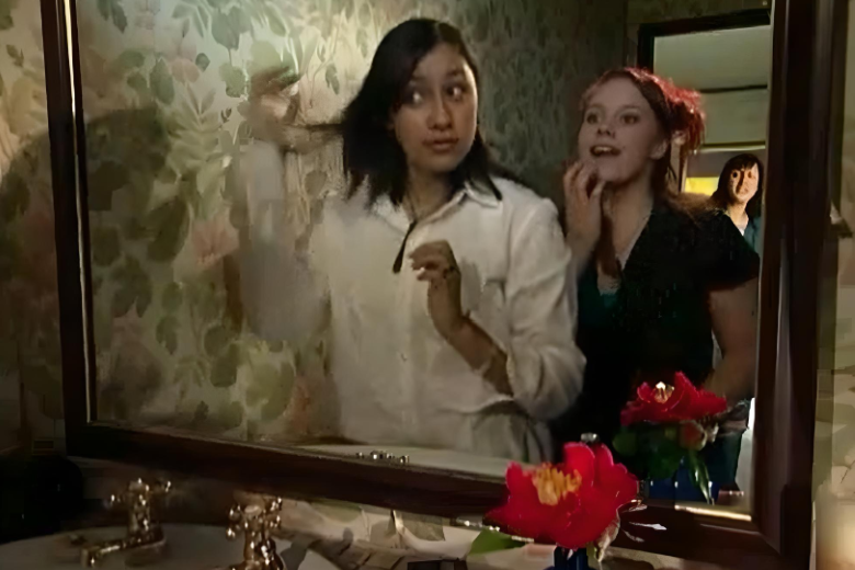 Hana and Jo getting ready in front of a mirror.