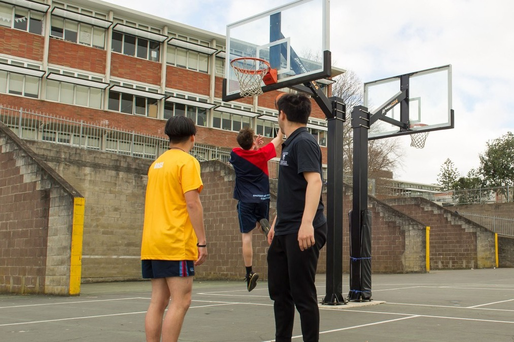 Students playing basketball.