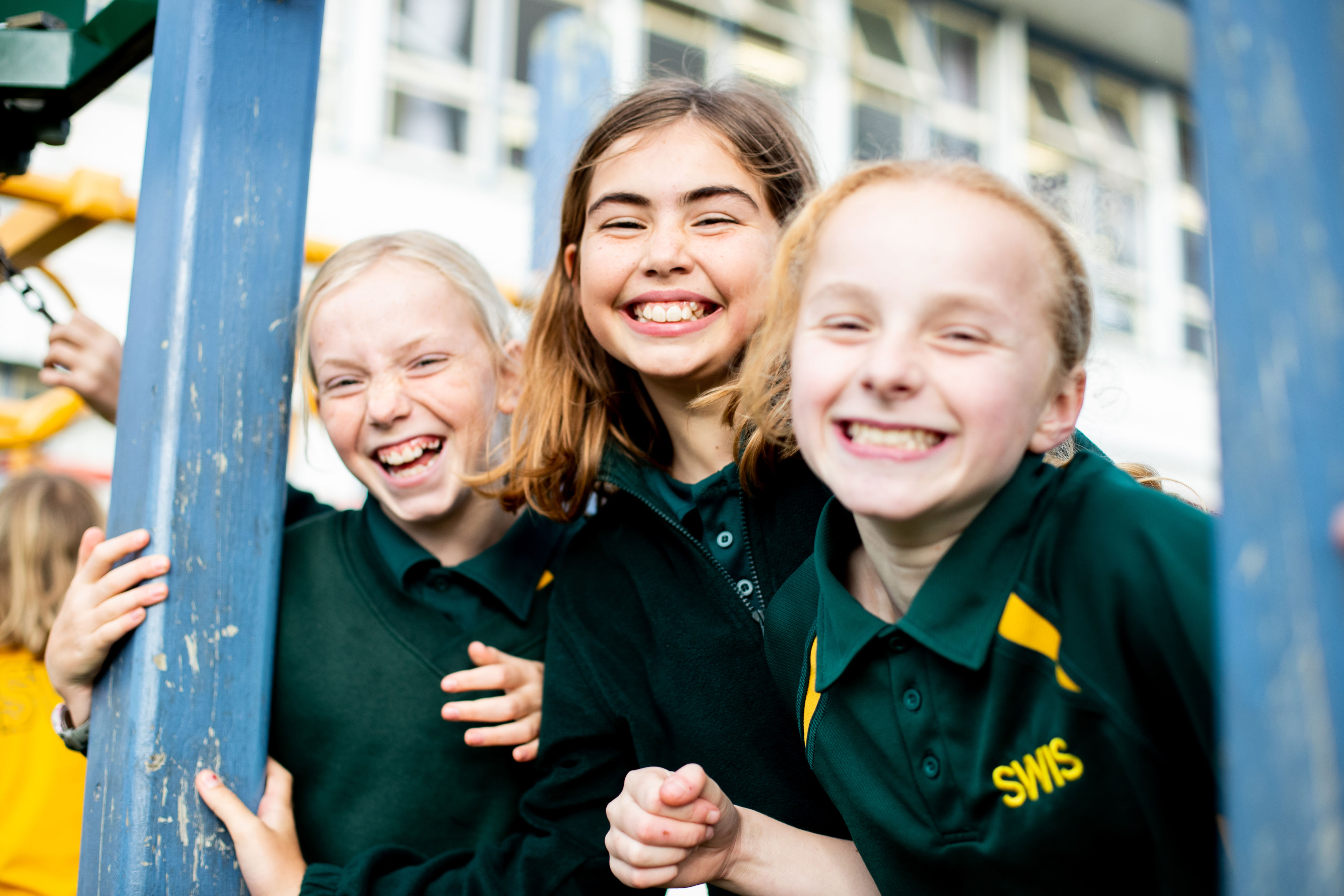 Photo of three children smiling