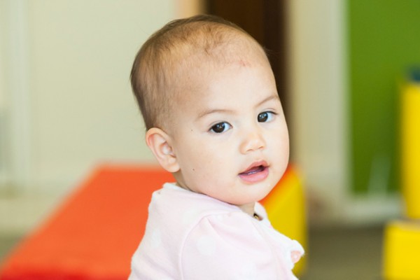  A toddler standing up facing the camera