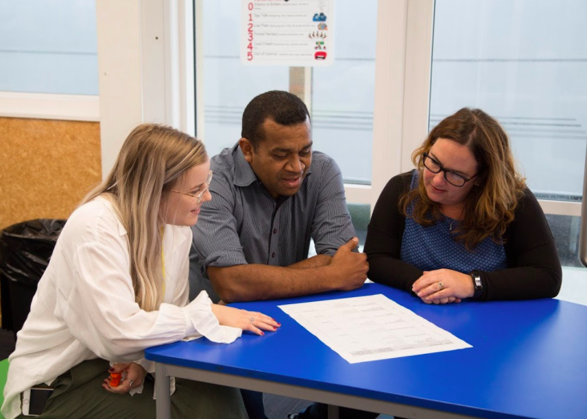 Three teachers working together.