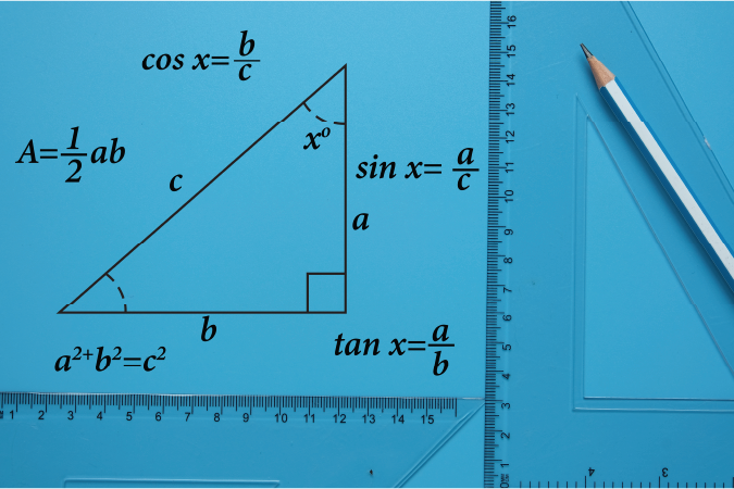 A picture of pencil, set square and right angle triangle drawing with formula on blue background. Geometry and trigonometry concept.