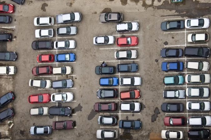 Birds eye view of cars in a parking lot.