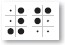 White sheet with seven large black dots and five small dots.