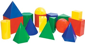 A collection of solid three-dimensional blocks in various shapes and colours.