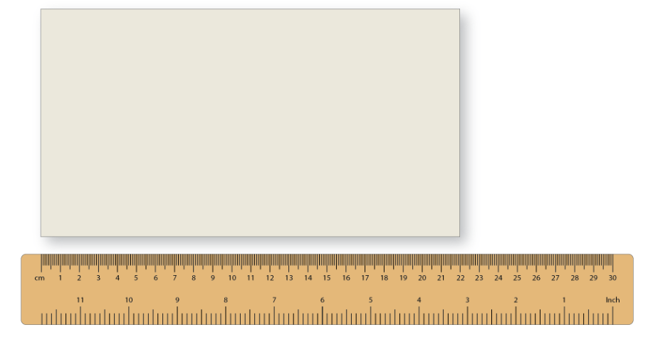 A white envelope and a ruler measuring length at 22 centimetres.