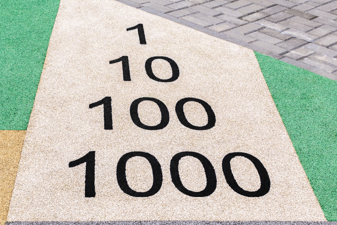 Numbers engraved on the ground: 1, 10, 100, 1000.