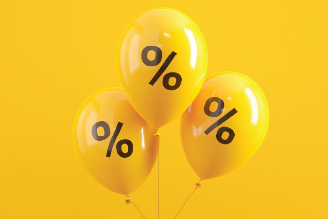 Three yellow balloons with a percentage symbol on each.