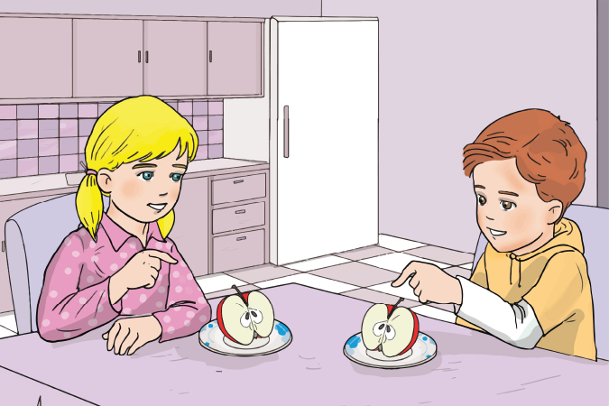 A girl and a boy sitting at the dining table, both pointing at the apple on their plate.