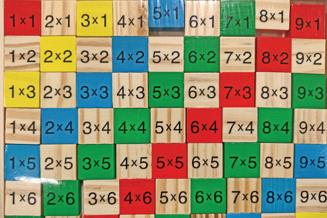 Wooden blocks with a variety of different maths equations.