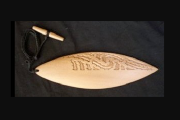 A traditional Māori instrument called a pūrerehua.