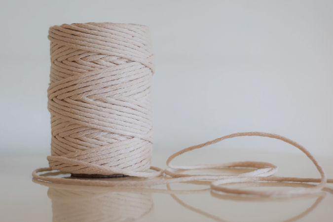 A spool of white yarn.