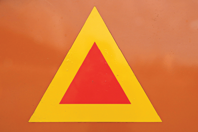 Triangle within a triangle on an orange background.