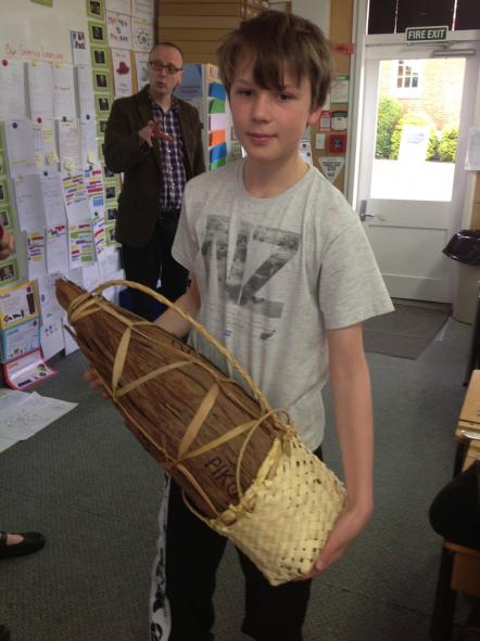 Student holding pōhā.