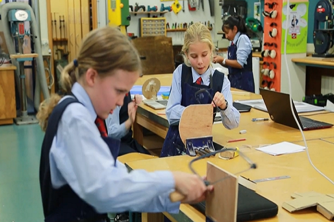 Students working on their mirrors in class.