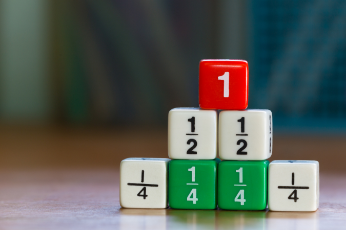 A stack of seven dice; number 1 on top, then two half fractions, and four quarter fractions on the bottom.