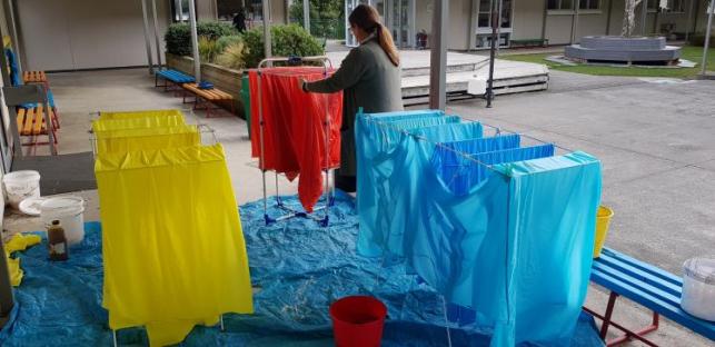 Dyed lavalava drying outside.