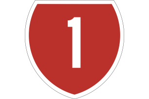 State Highway 1 road sign. Red shield shape with a number one in the centre.