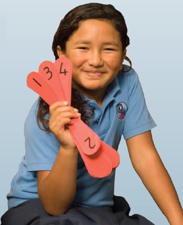 A child holding cards labelled 1-4.