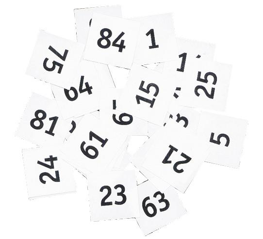 A pile of random numbers on individual pieces of square paper.