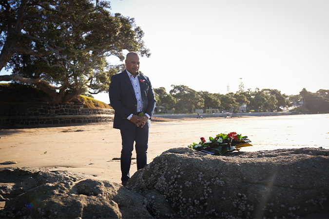 Man on a beach at a memorial