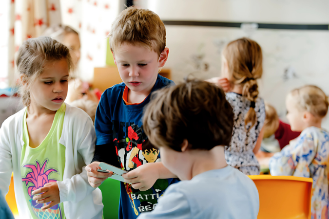Three students working on crafts.